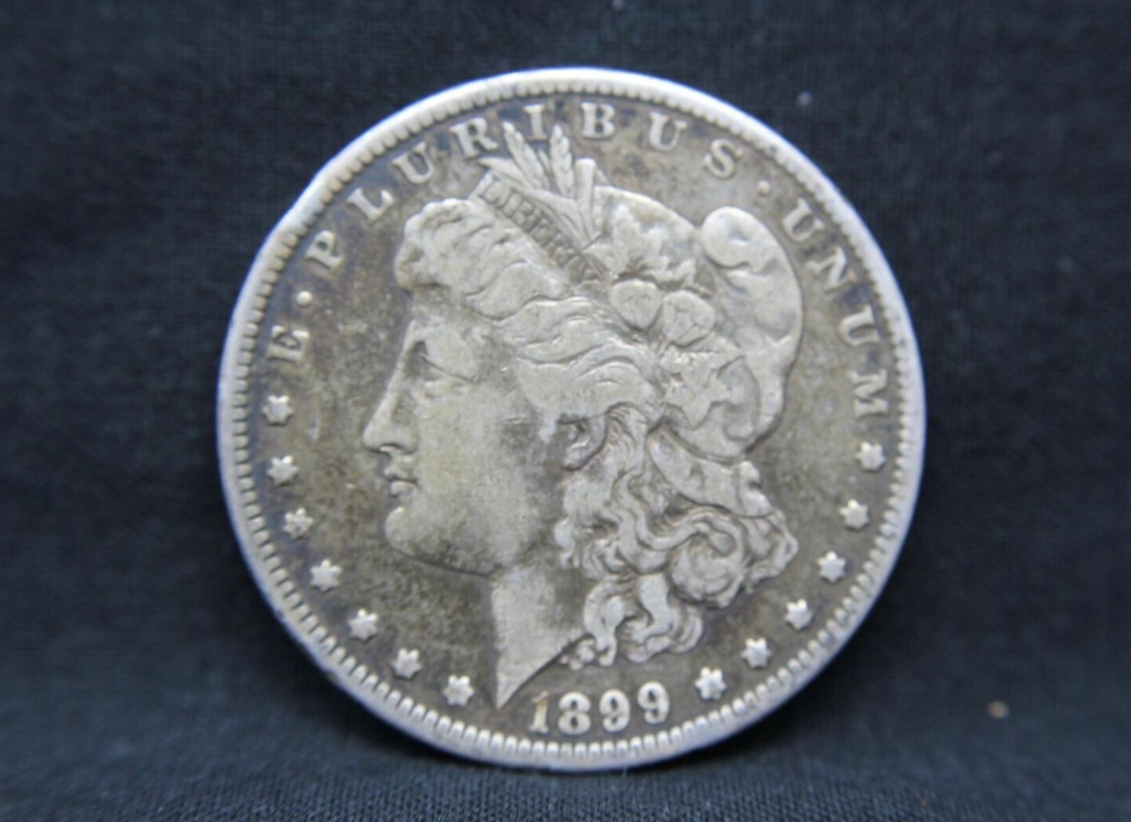 1899 O 90% Silver Morgan Dollar (56)