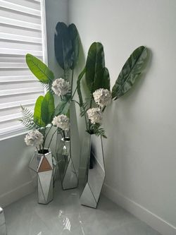 Glass vases with artificial plants