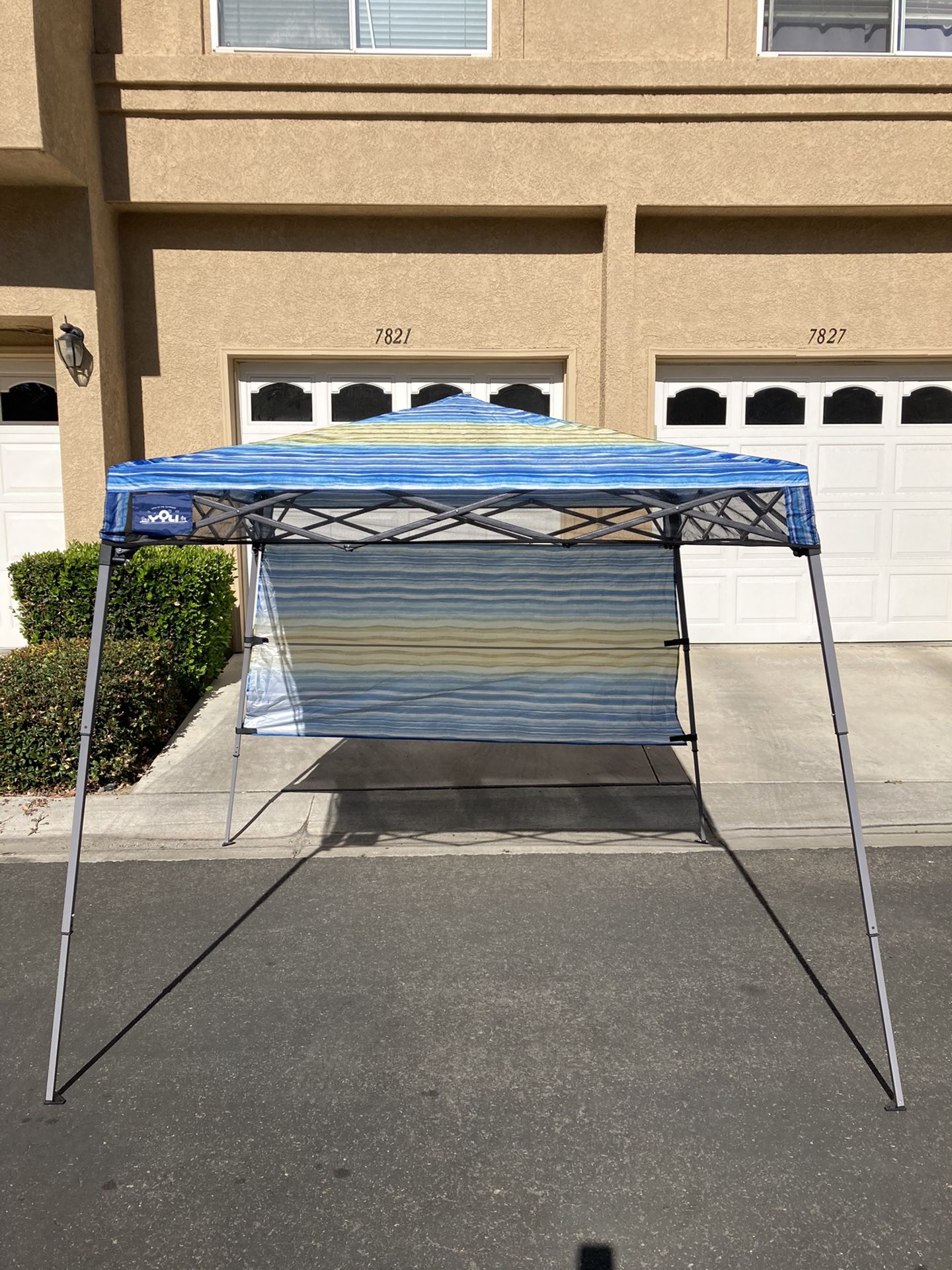 Yoli LiteTrek 36 7' x 7' Slant Leg Instant Canopy with Backpack. Retail Price at The Store $79.99 Plus Tax