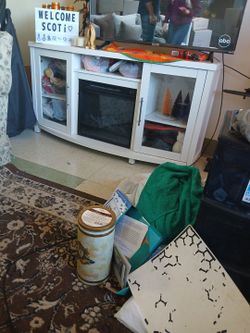 Fireplace glass doors storage entertainment cabinet.About 48 /50 " Stereo equipment. long TV.
Entertainment