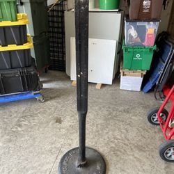Sign post with cast-iron base approximately 4 feet tall