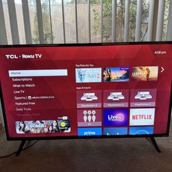 TCL 40-inch 1080p Smart LED Roku TV - 40S325 with TV Stand