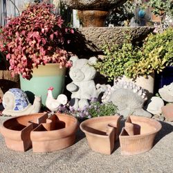 half-round terracotta and planters designed to fit around an umbrella pole - $35 a pair. Two pairs shown in the pictures.