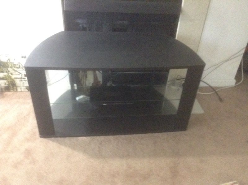 Tv stand r table made with wood and glass