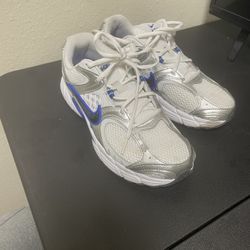 White and Silver Sneakers with Blue Accents