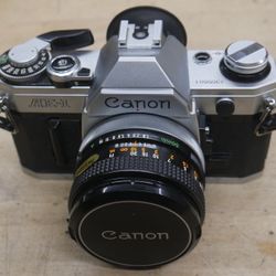 Canon AE-1 Program 35mm Manual SLR Film Camera with 50mm 1:1.8 Lens. used. tested. in a good working order. 