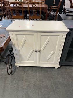 Small white farmhouse cabinet (in store)