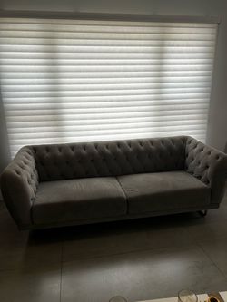Tufted gray sofa