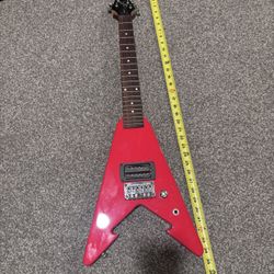 First Act Mini Red V guitar