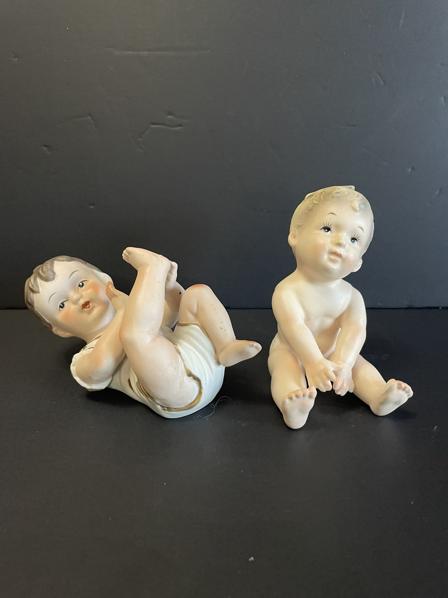 (2) 1950’s Bisque Porcelain “Piano Baby” Figurines