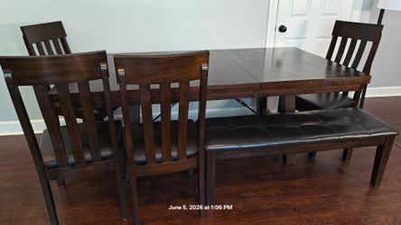 Wooden dining table for (4-8) people with 4 chairs and  bench for 3 people in good condition, it has extension peace, driveway pickup.
Table L60"*W42"