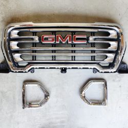 OEM Grill & Fog Light Bezels for a GMC Sierra 1500