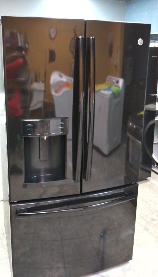 Semi New GE French Refrigerator. Works Good And Is In Mint Condition