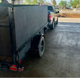 6x10 trailer 2022 big Tex with 4ft walls no rust or frame damage. Wood is replaceable and can customize to liking.