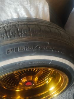 13 inch wire knock off wheels 24 k dipped with pi55 tires