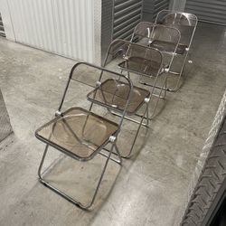 Set of 4 vintage "Plia" folding chairs with a chrome frame and smoked acrylic seat and back, designed by Giancarlo Piretti for Anonima Castelli 