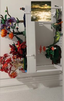 Lego set up with shelf included plus another flower Lego set