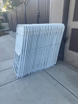 20 White folding chairs