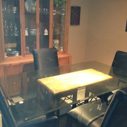 Dining Table Glass Top With Four Black Chairs