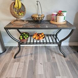 Ashley Furniture Antigo Sofa Table featuring natural slate tiles and a gunmetal finished metal