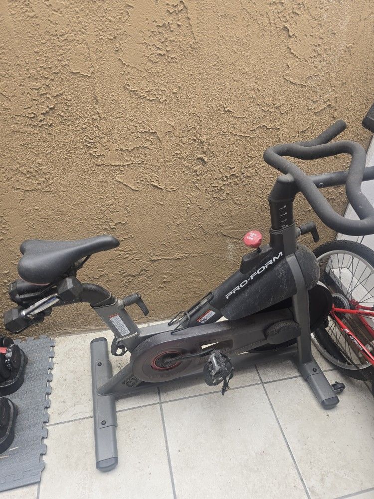 Exercise Bike And Bowflex Dumbbell