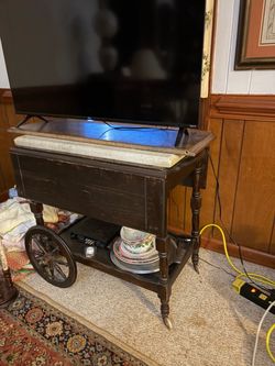 Antique tea cart with marble slab atop