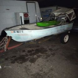Fishing Boat With A 7½ HP. Johnson Outboard Motor And Trailer