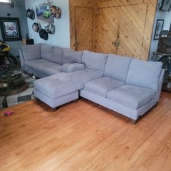 2 PC Sectional Grey In Color. Soft. No Damage Or Smoking