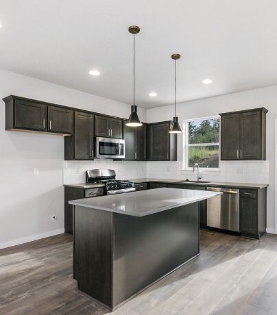 Black/brown and gray quartz -Full kitchen cabinets with quarts with island..brand new.... appliances not included but sold separately.. remodel your