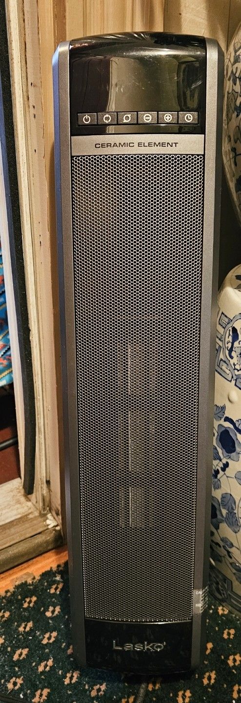 New 1500W Lasko heating tower with remote.