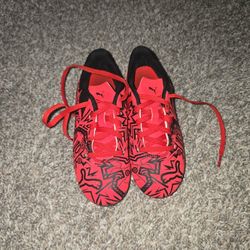  Puma x Christian Pulisic Tacto II FG/AG kids' soccer cleats in the red/black