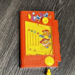 vintage Lucky Ball hand held pinball wind up skill game in the red box