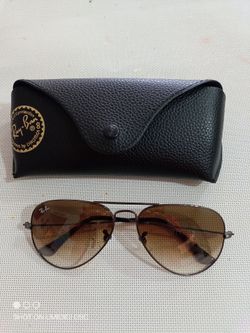Ray-Ban sunglasses, 55mm  bronze/brown. Unisex.
New.