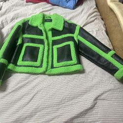Lime green and black shearling coat and matching boots