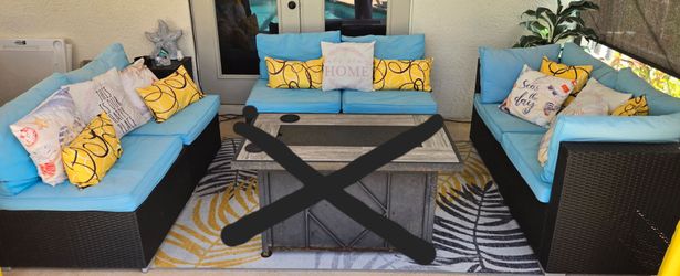 Three piece wicker patio set with cushions
