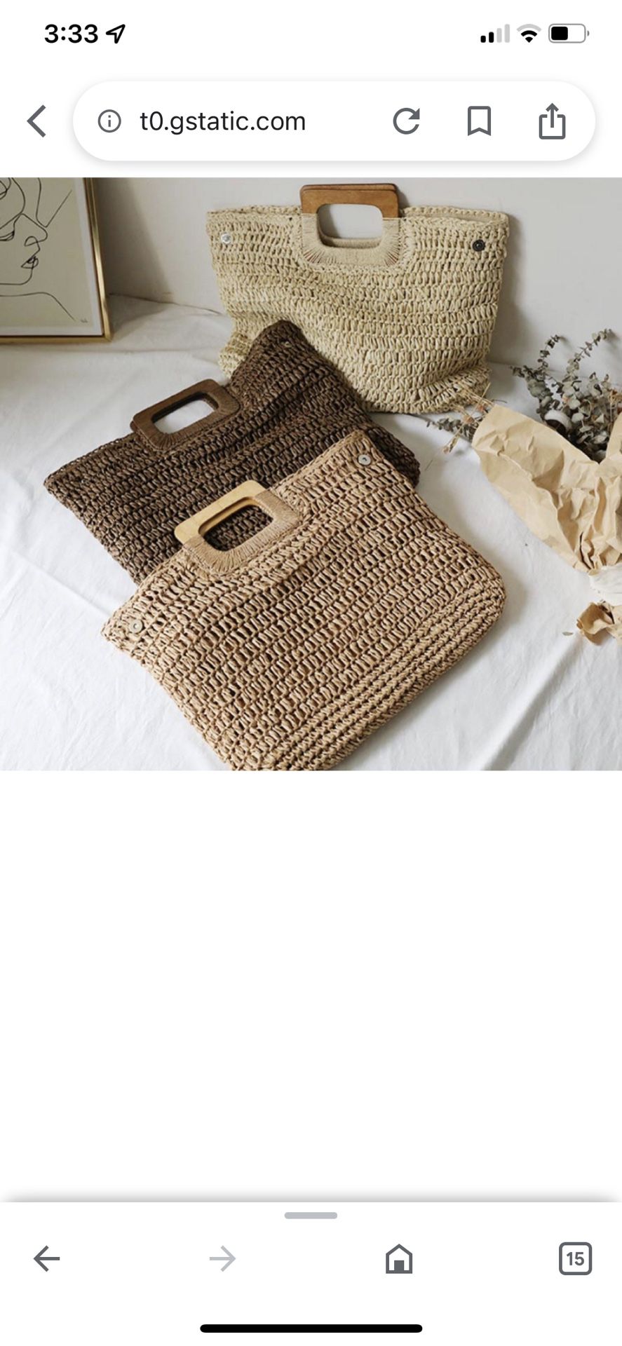 tan woven bag with wood handles