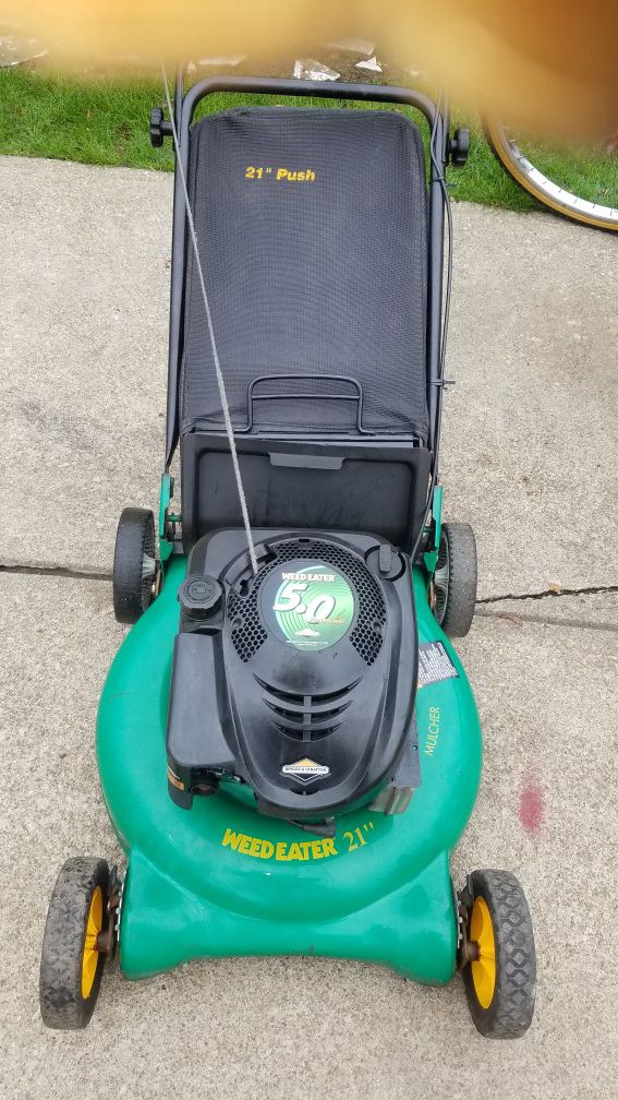 Weed Eater Lawn Mower 5.0 horsepower 21 inch cut push lawn mower with bag $100