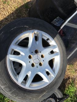 Mercedes stock wheels 16 inch . 2 good tires