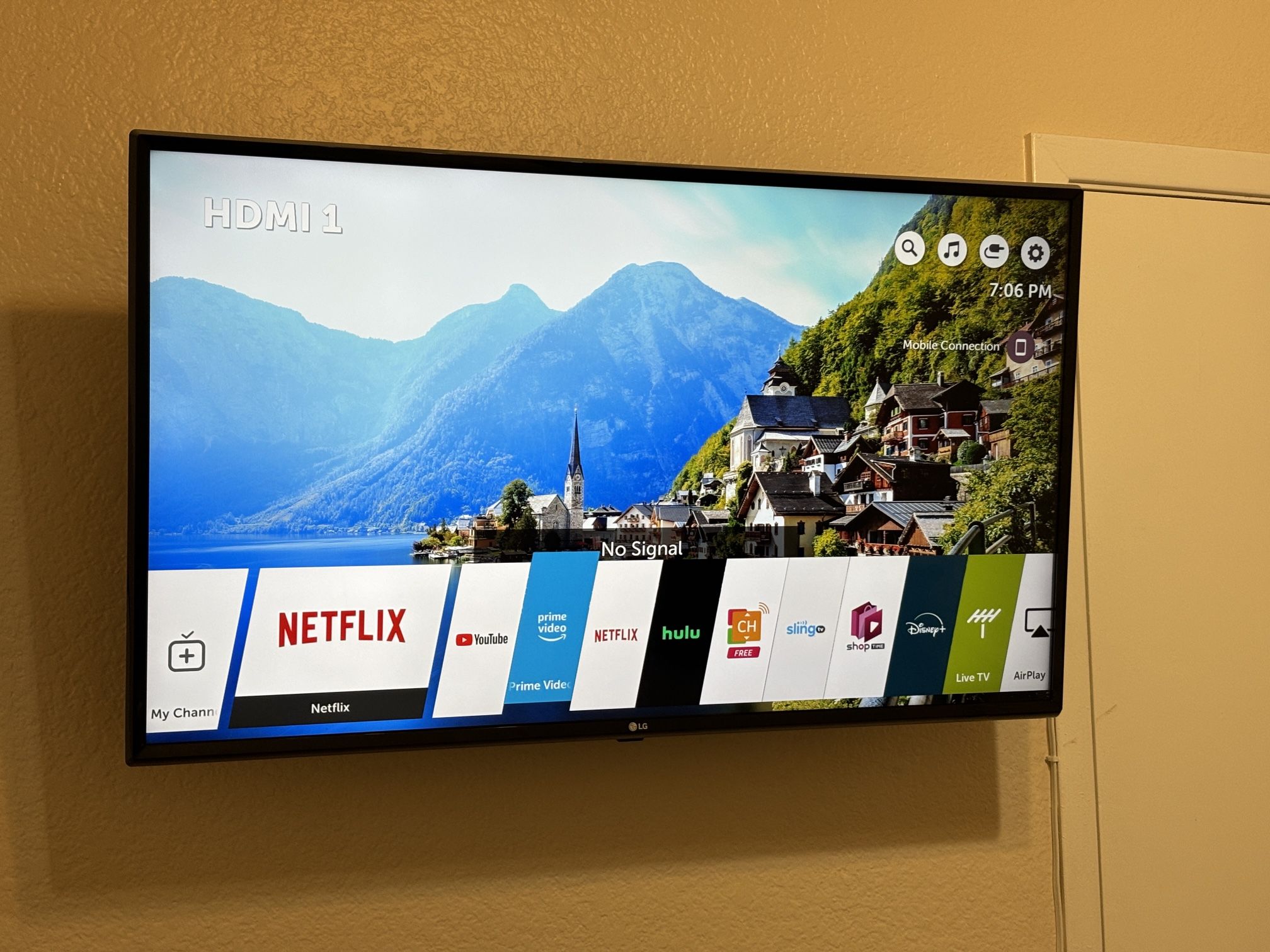 LG 43’ TV With A Wall Mount And A Remote Control 
