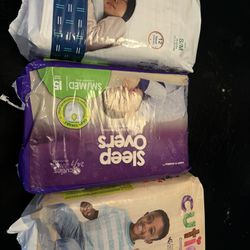 4 packs of diapers pull-ups or regular size 6-7
