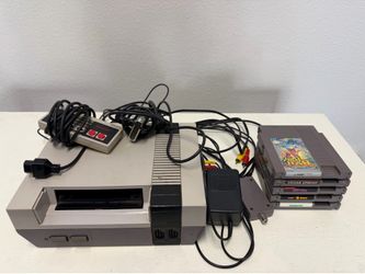 Nintendo NES with controller five games cords