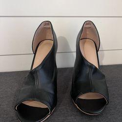 Black High Heels Half upper cross over, open toe high heels. Size 7