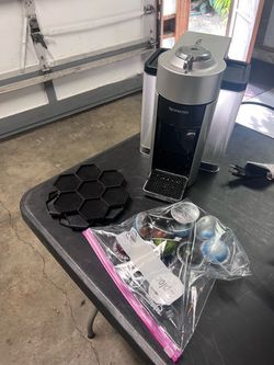 Nespresso w/ pods and pod holder.
