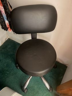 Black vinyl cushioned medical spa office vanity rolling chair