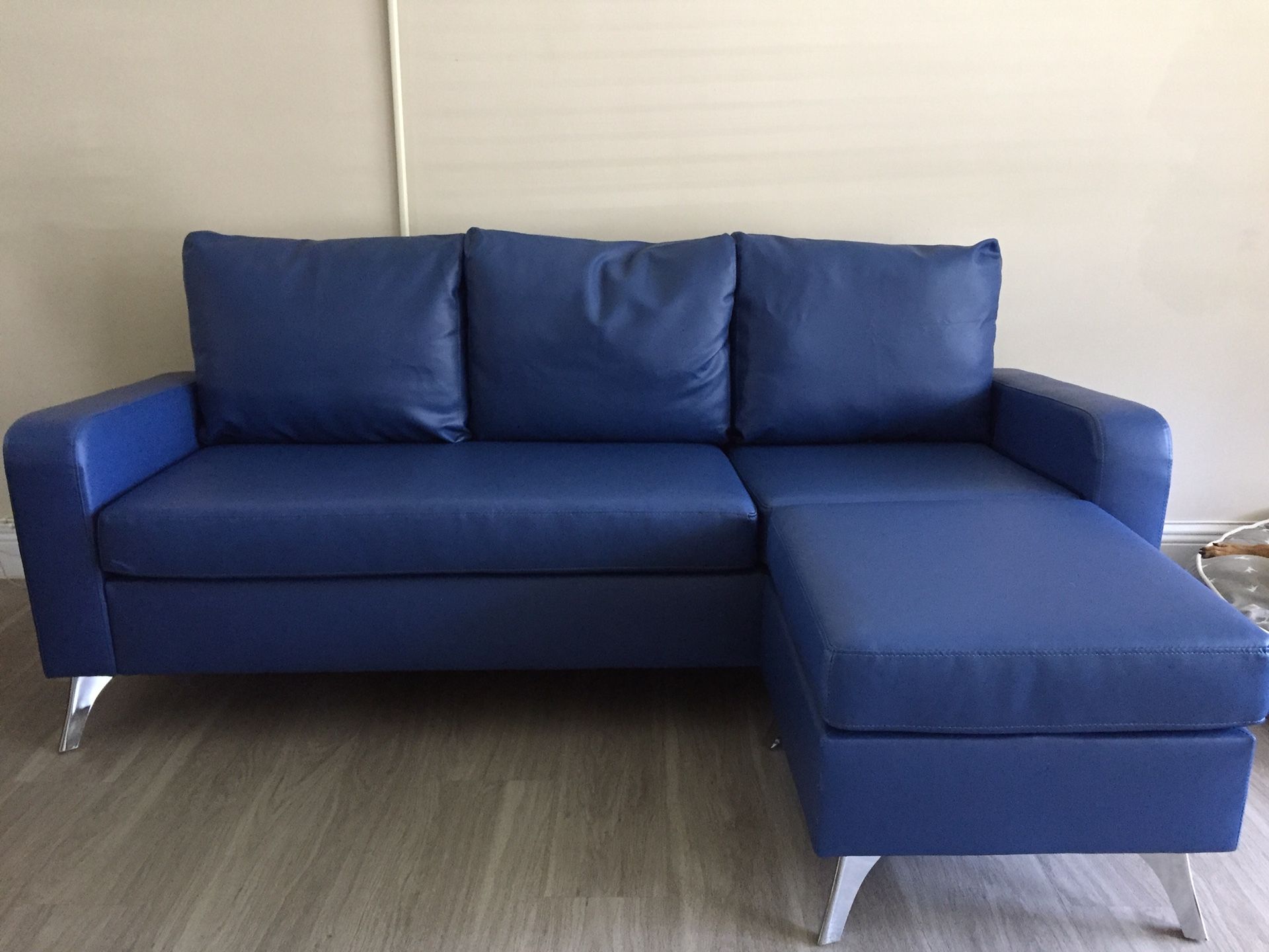Blue Faux Leather sofa with Ottoman, 2 pillows
