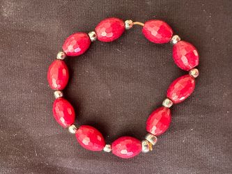 Vibrant Red Faceted Oval Bead Stretch Bracelet with Silver-Tone Spacers
