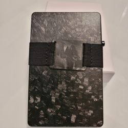 Premium composite carbon fiber wallet with POP UP ability. RFID blocking with cash band