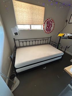 Wrought iron day bed with pop up trundle