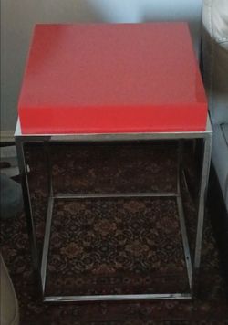 Beautiful side table with red top and stainless steel