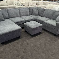Gray Reversible Chaise Sectional And Ottoman